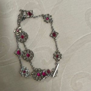 Pink and silver toned bracelet.